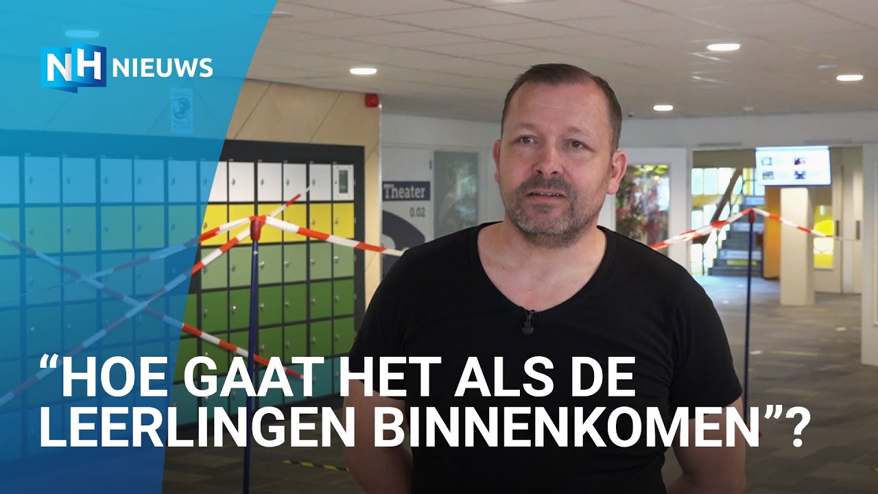 Rondleiding: Conciërge laat anderhalve meter maatregel van school zien.