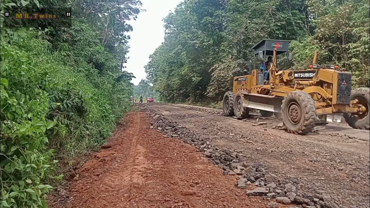 Motor Grader Demolishes Old Asphalt to Repair Road