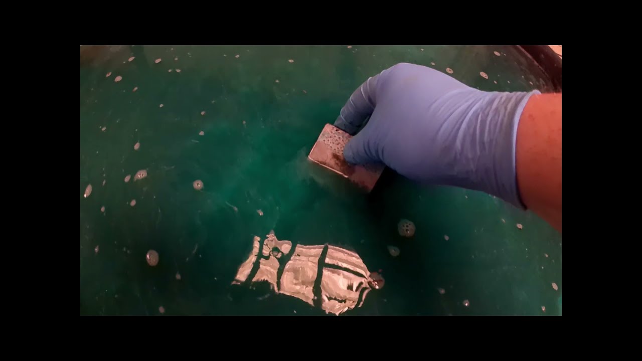 Copper saline etching solution for print making.