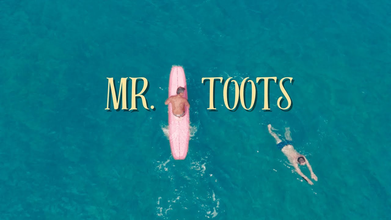 Mr. Toots surfing in Waikīkī | Close up drone footage 4k