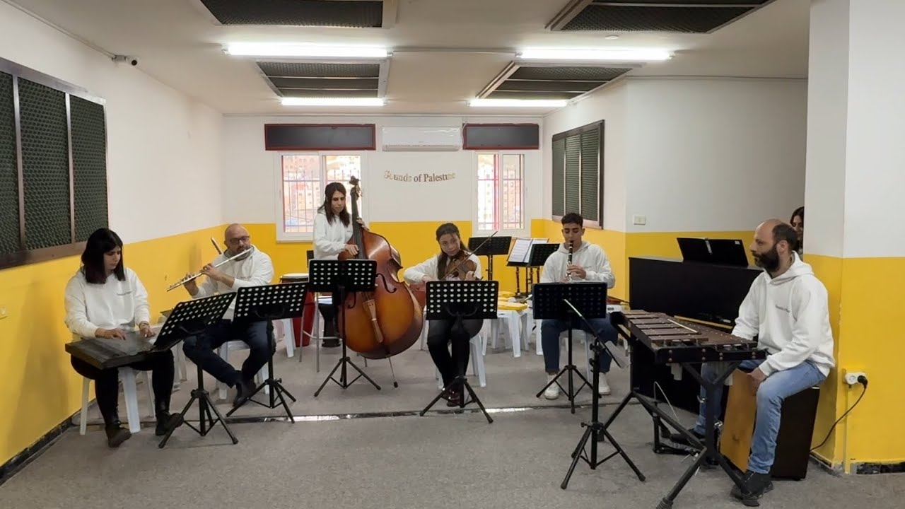 The music teachers of Sounds of Palestine perform a piece from Ommi Thoma Ommi, joined by Najd choir
