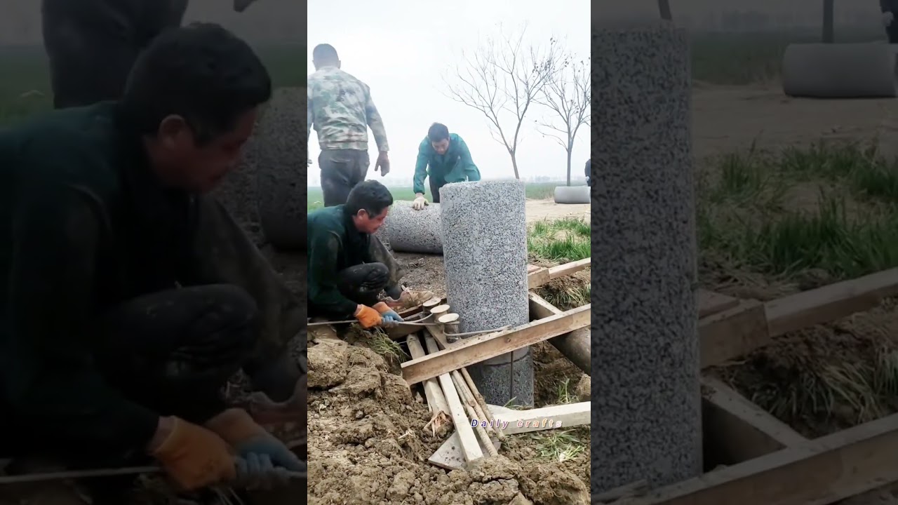 الحرفيون يقومون بمهارة بتركيب أنابيب الصرف الصحي الخرسانية في الآبار