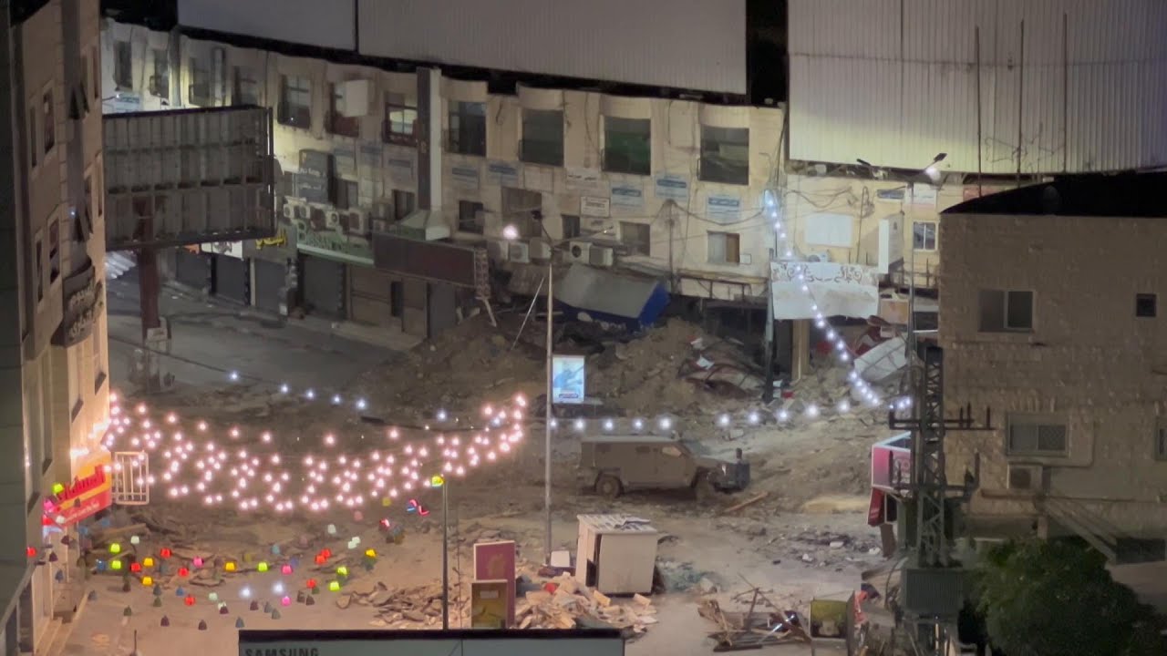 Clashes erupt between Palestinian protesters and Israeli soldiers in the city centre of Jenin