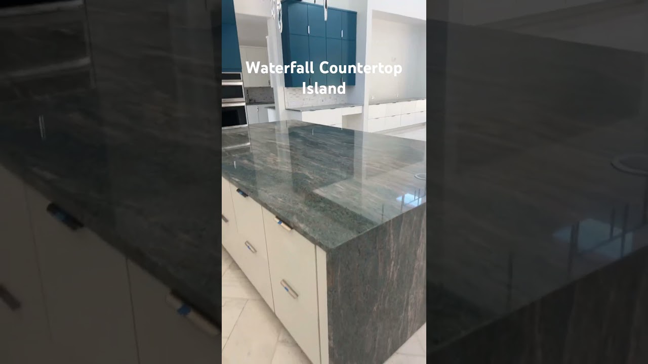 Waterfall Countertop Island at Kitchen. Granite. 