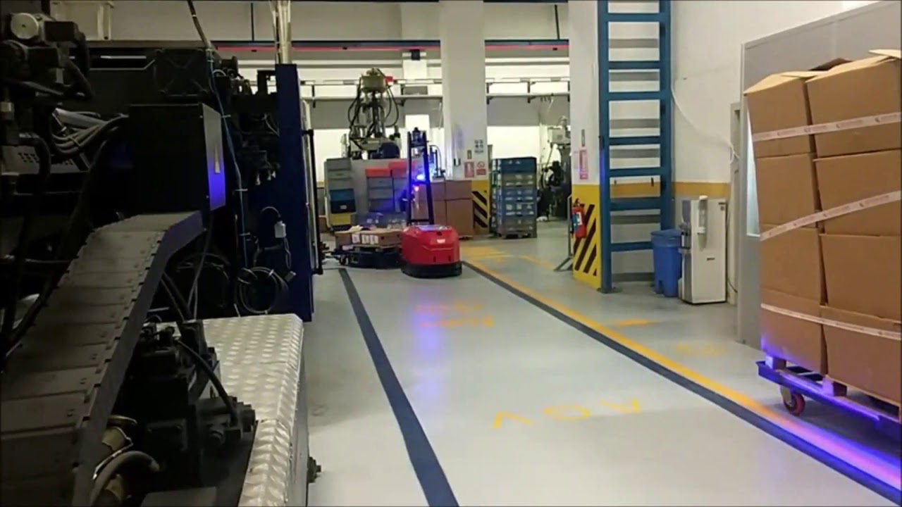 Robos Tugger AGV with e-frame trailers.