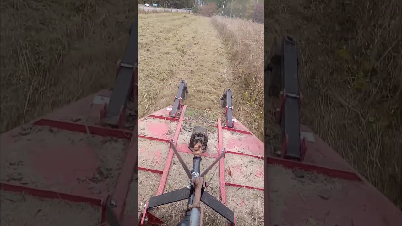 bushhog pulled by Ford New Holland 5030 farm tractor