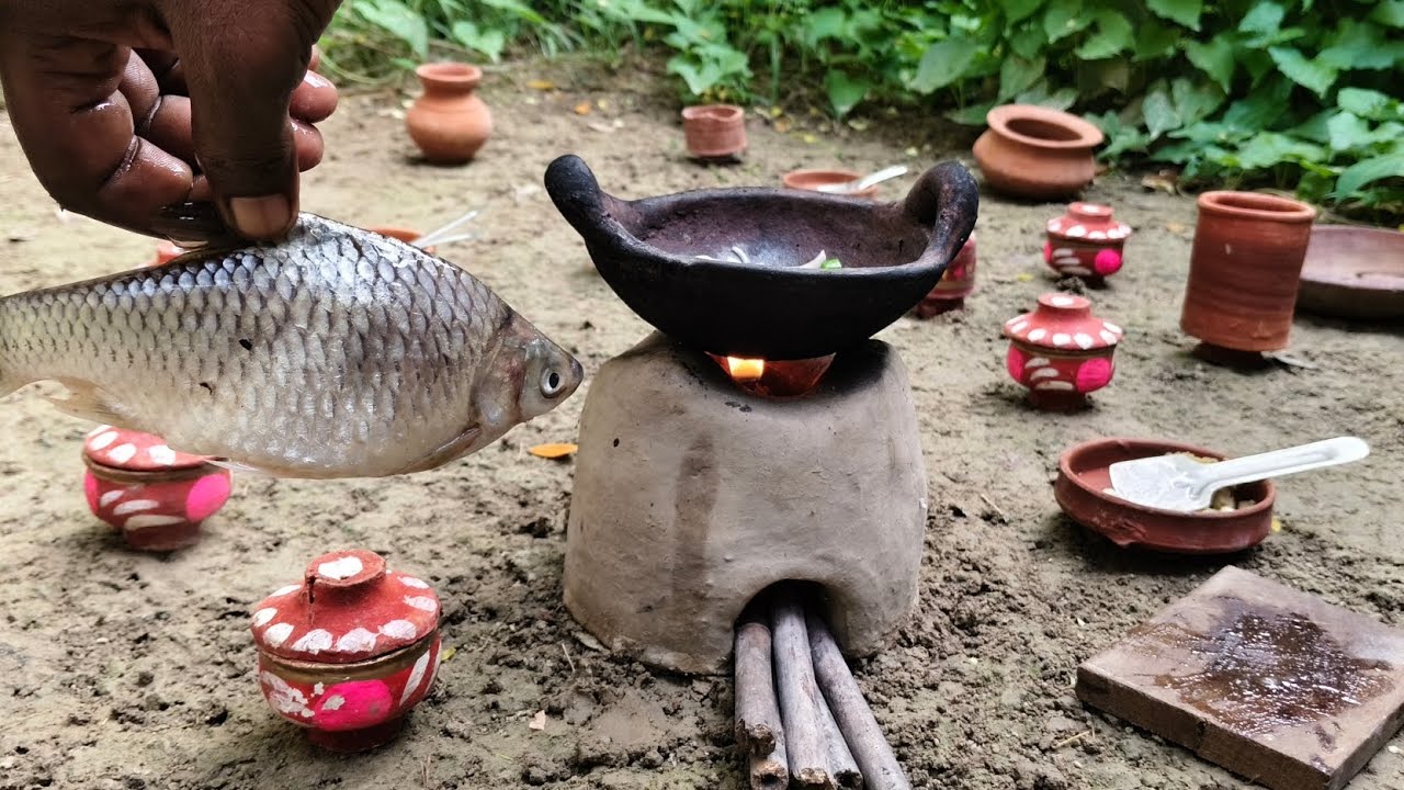 Cooking fish on a clay stove in a village kitchen |Fish recipe