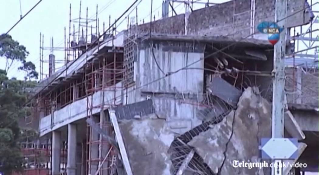 South Africa building collapse: rescue workers pull survivors from the rubble
