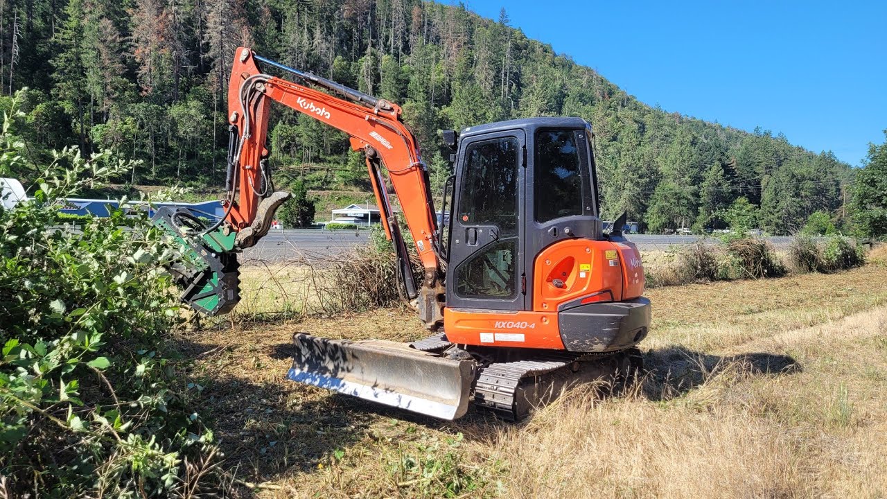 Mulching briars by the freeway with the Kubota KX-040 and Brush Hound FX26 Defender