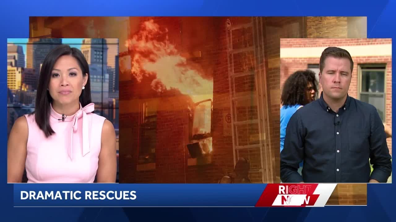 Residents jump out window of burning building to mattress below