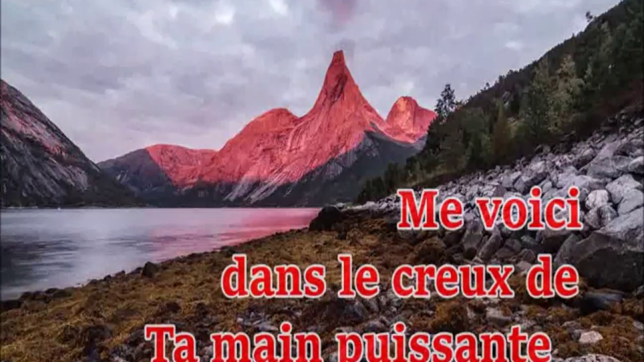 Me voici dans le creux de Ta main puissante