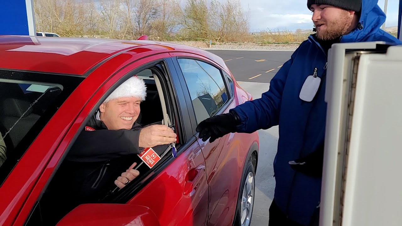 Man working at a car wash surprised with a new car from Secret Santa