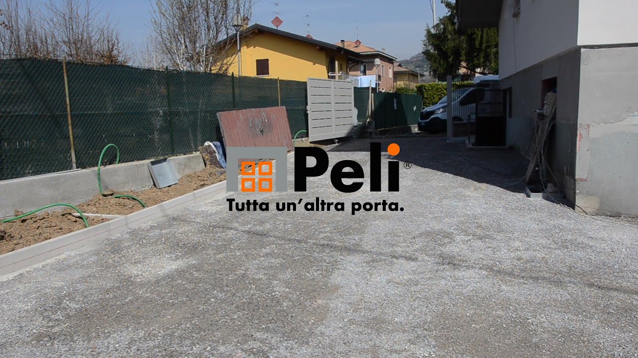 Installazione Porta Sezionale Peli modello Ebano