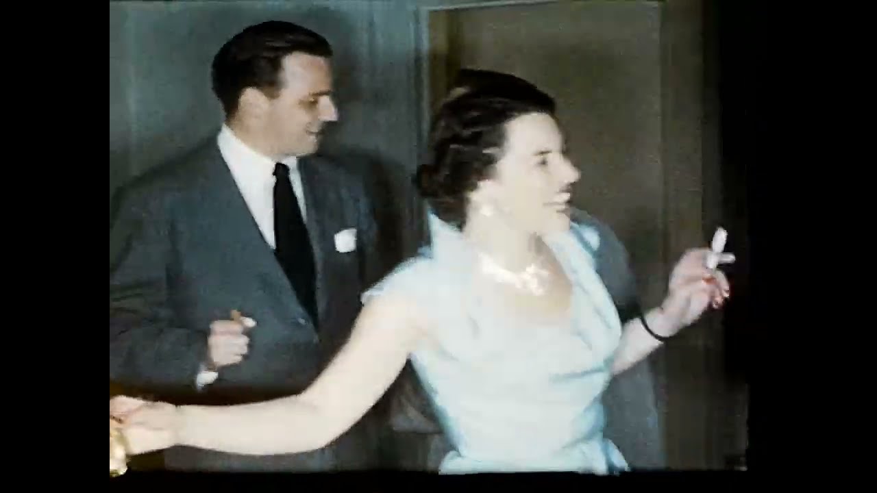 8mm home movie, 1950s, party guests, dancing, Christmas presents