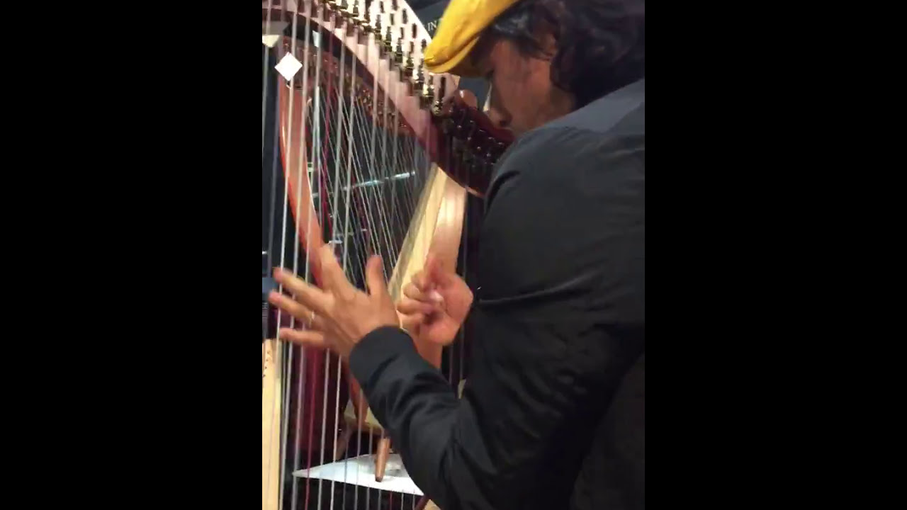 Edmar Castaneda plays the new Dusty Strings mariachi harp, the Serrana 34