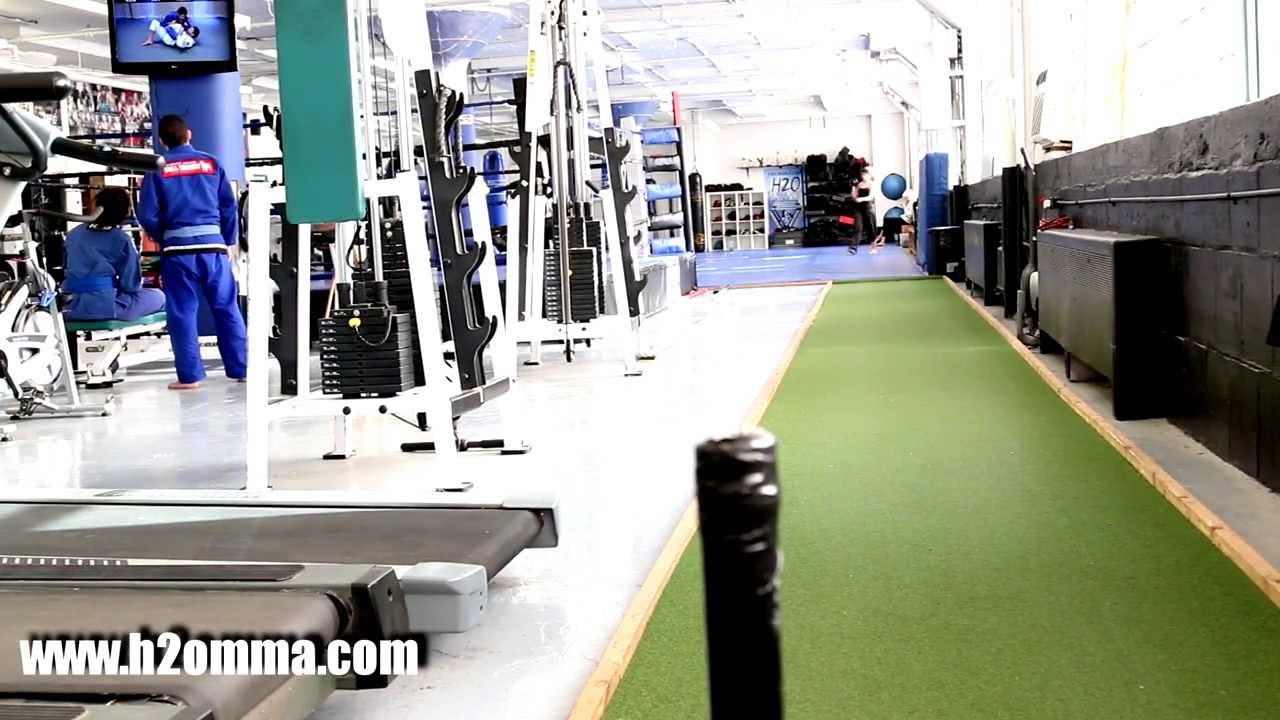 Sled Push Training on Grass Track at H2O MMA