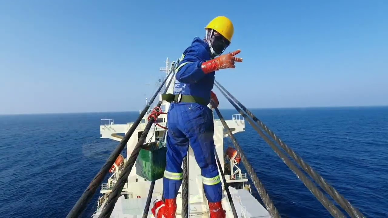 Crane wires greasing on Ship