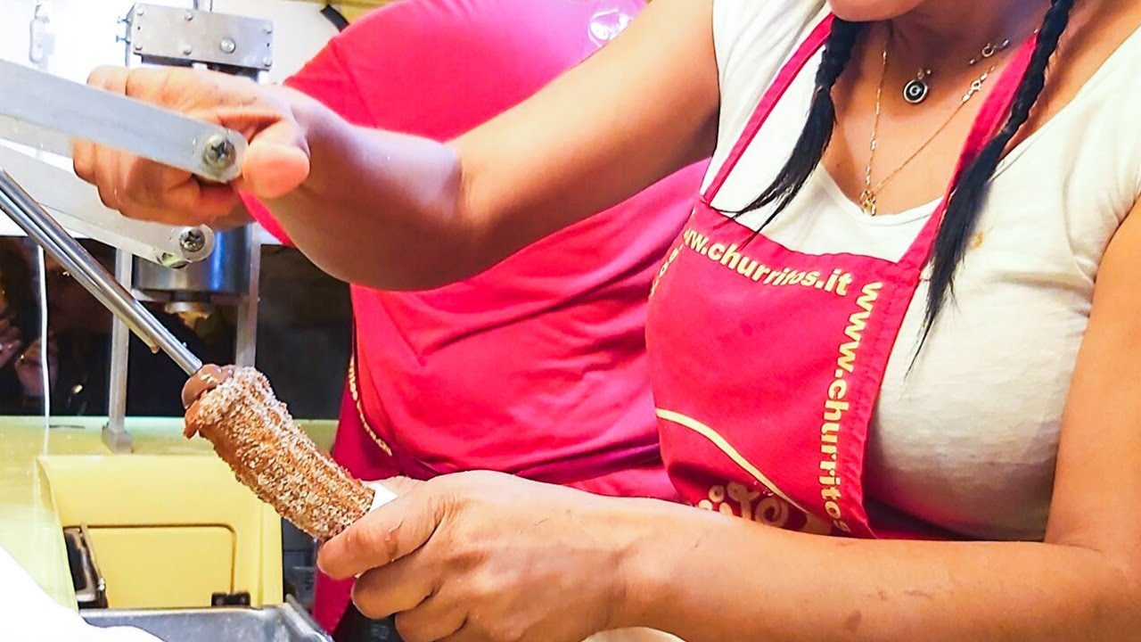 The Queen of Huge Stuffed Sweet Churros. Venezuela Street Food seen in Italy