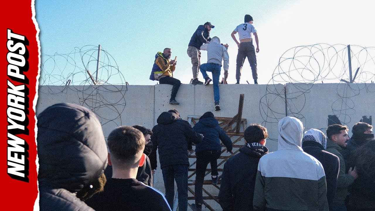 Wild Footage Shows Pro-Kurdish Protesters Storming Border Wall Into Syria