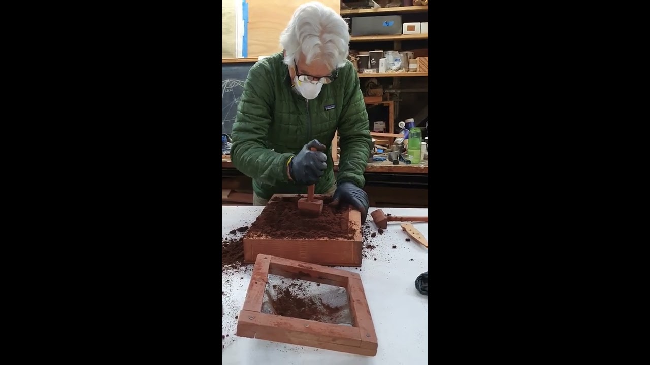 Flask preparation for bronze casting of riveting dolly 1 of 2. By Robert Darr..