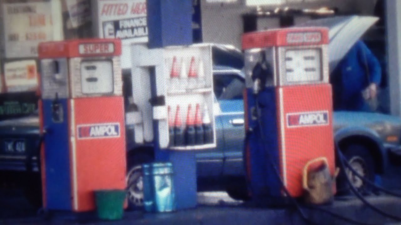 Petrol stations and cars filling 1980's Melbourne
