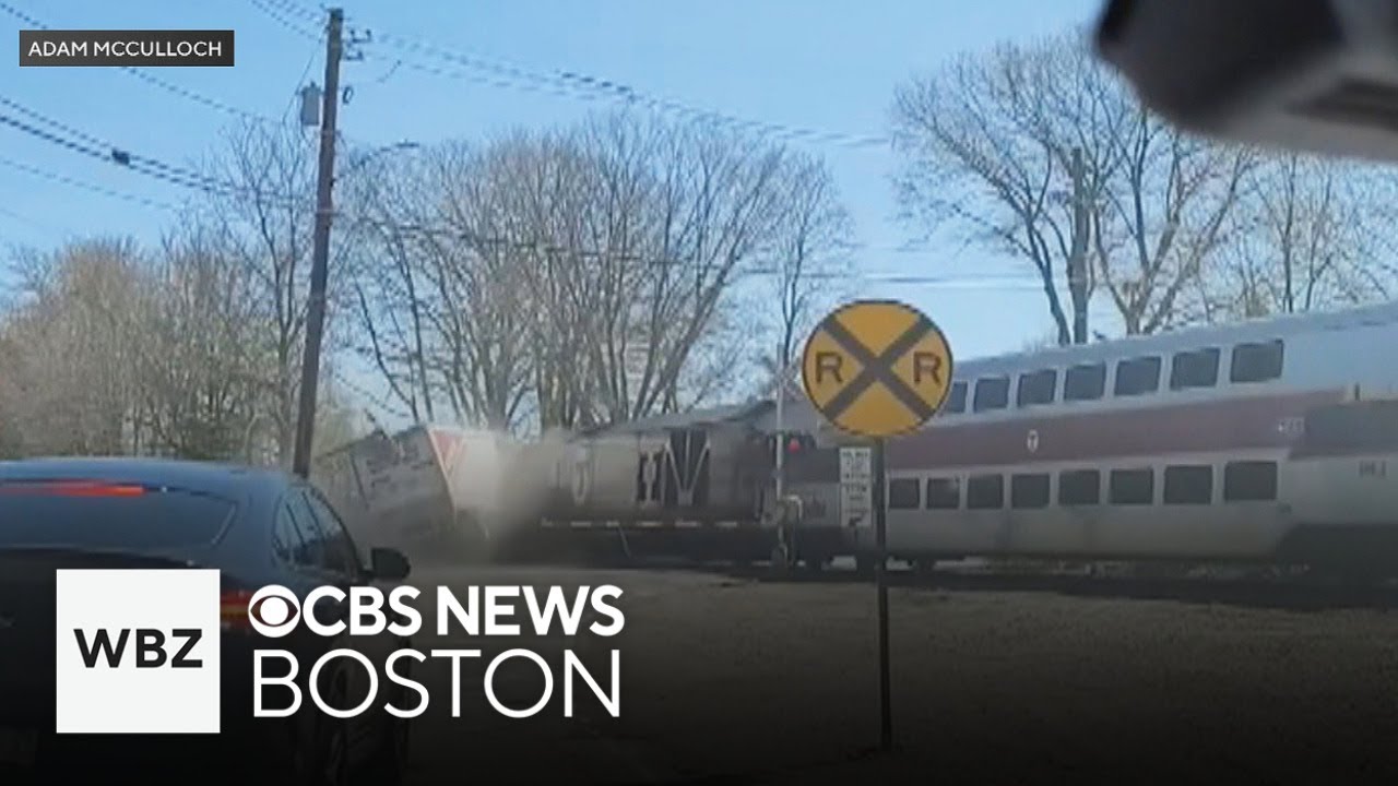 Video shows train crash into tractor-trailer in Canton