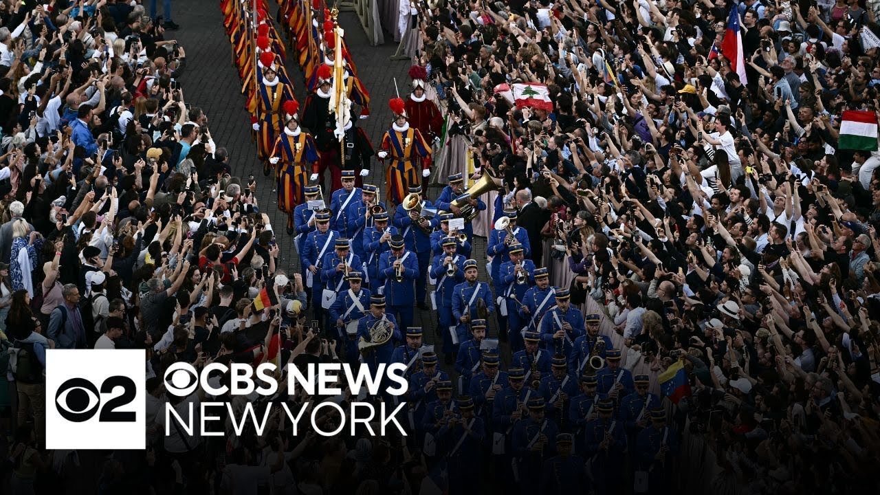 As new pope is elected, marching band, Swiss Guards arrive in St. Peter's Square