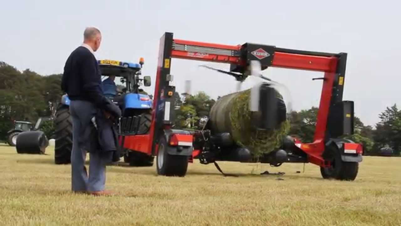 Grasstech 2014 - New Holland T7.220 demonstrating Kuhn Bale Wrapper