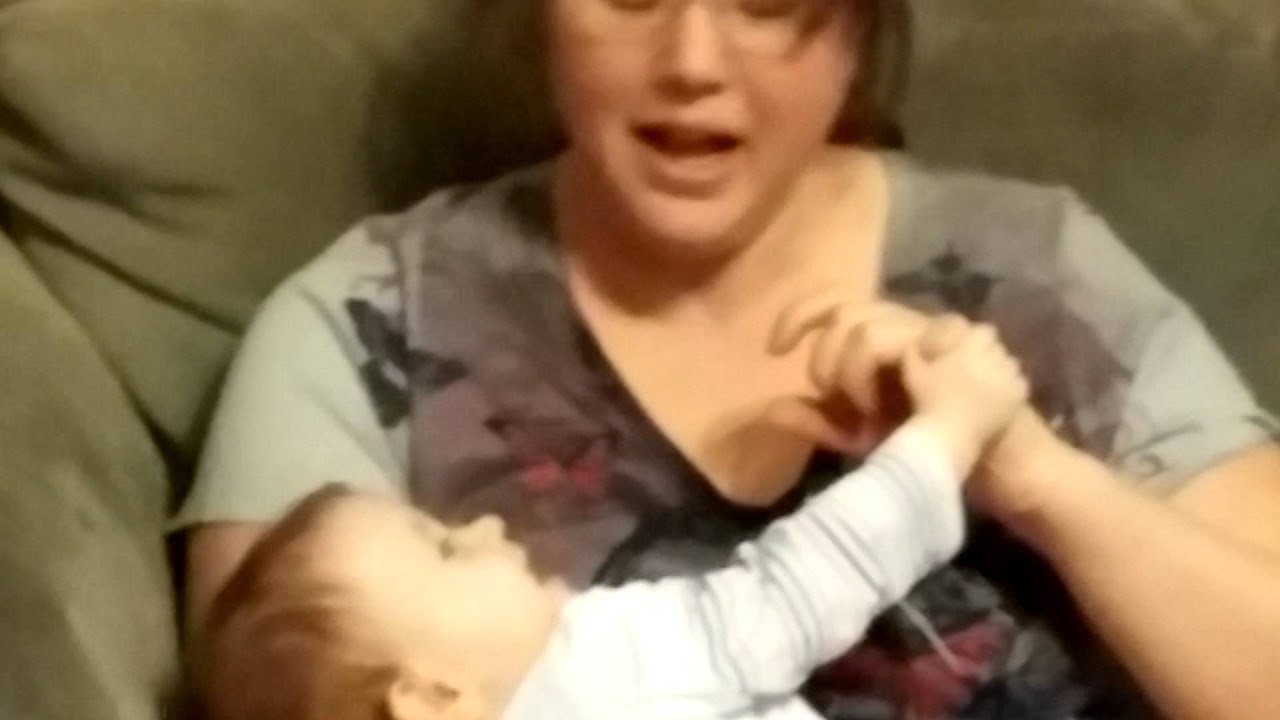 Mommy tickling baby and laughing