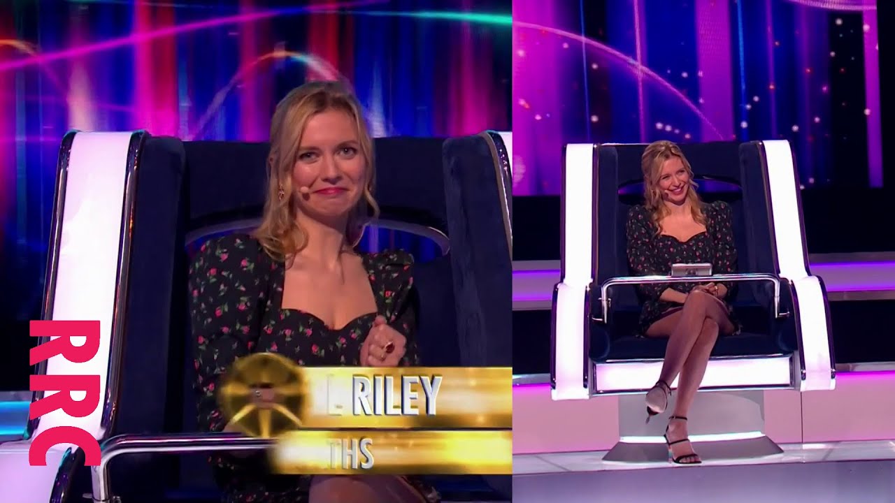 Rachel Riley @short skirt and multicoloured heels