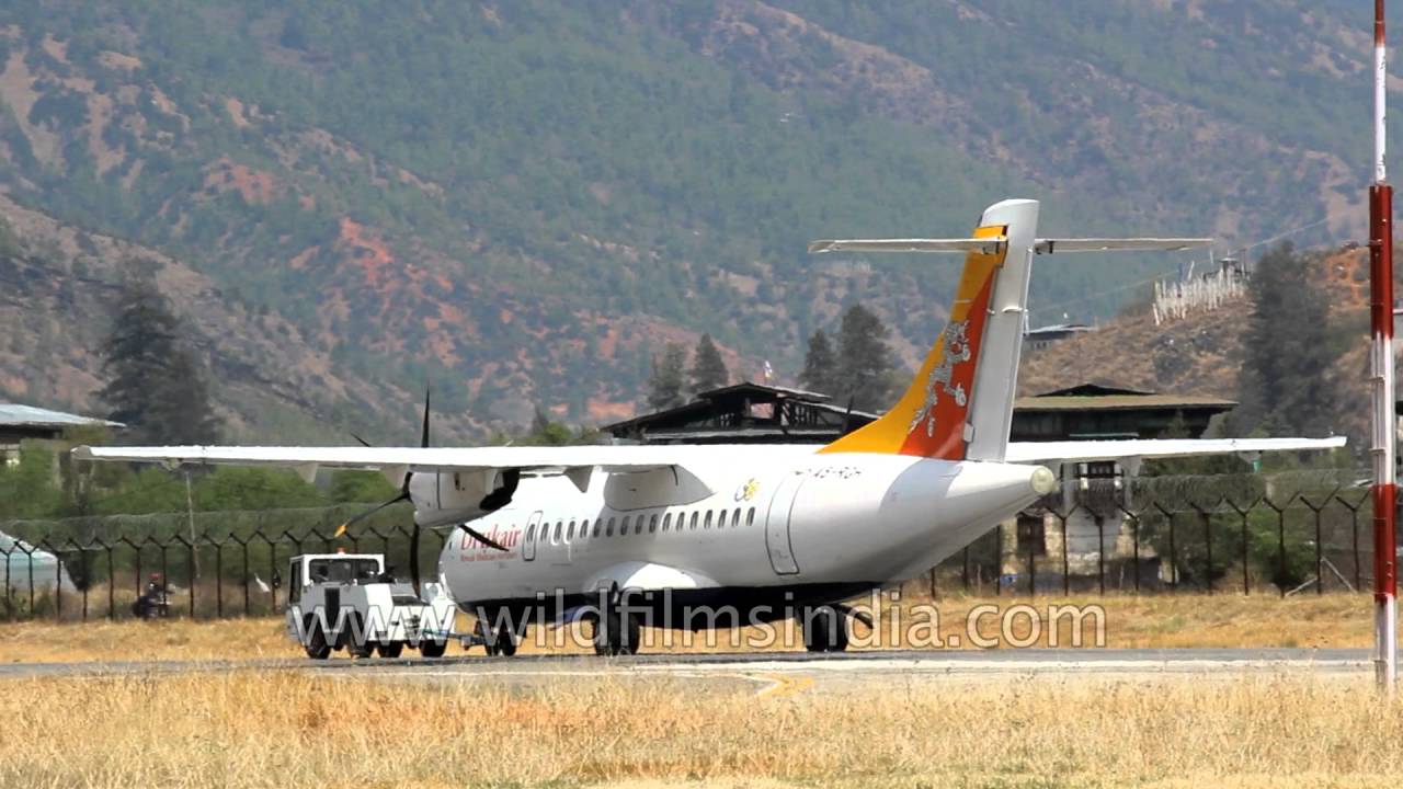 Pushback tug gets a Druk Air flight ready for taxiing at Paro Airport