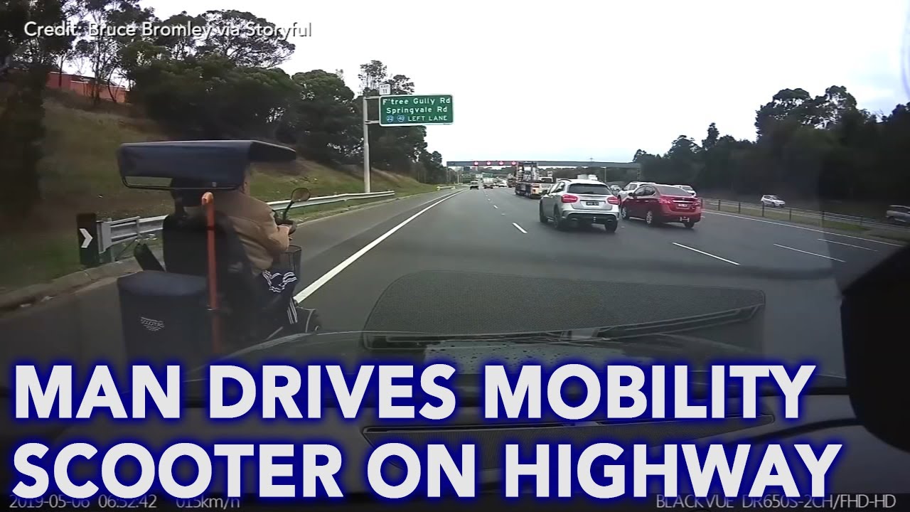 Video shows man driving a mobility scooter on busy Australian highway