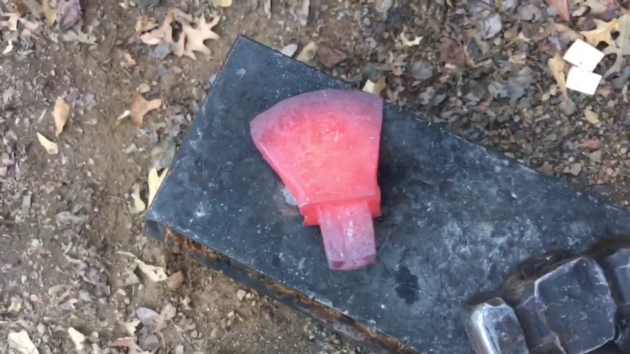 Blacksmithing/toolmaking forging a cutoff hardy
