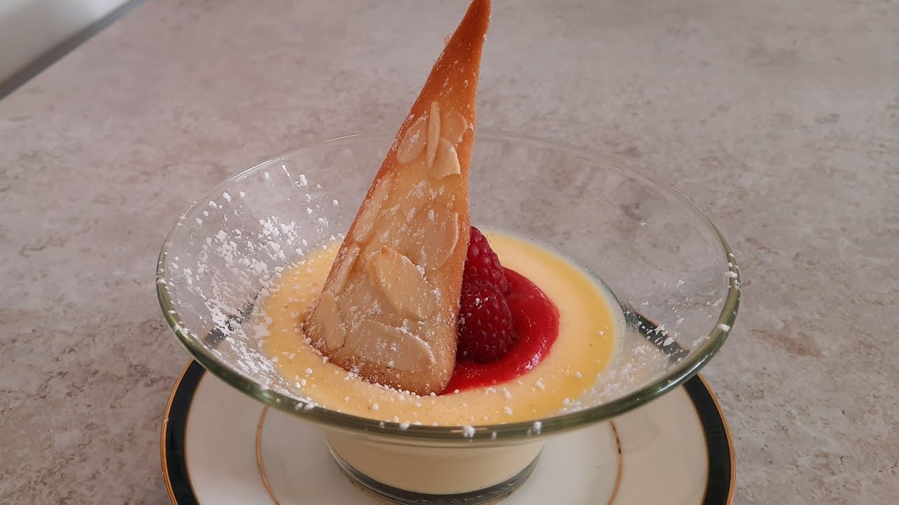 WHITE CHOCOLATE PANNA COTTA WITH RASPBERRY SAUCE AND ALMOND TUILE BISCUIT