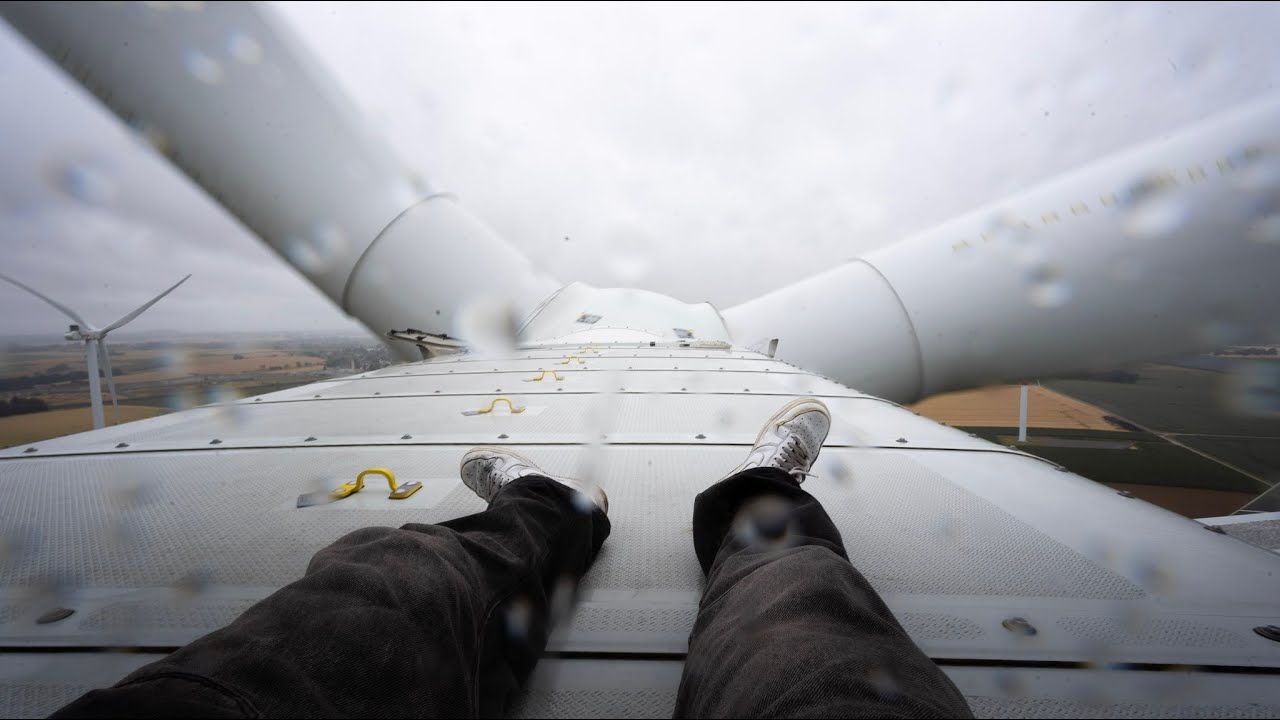 Climbing a BIG WINDTURBINE at a rainstorm