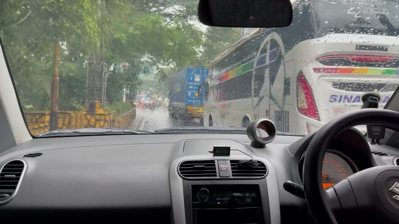 Driving a car in the rain in the afternoon #marutiritz #suzukisplash
