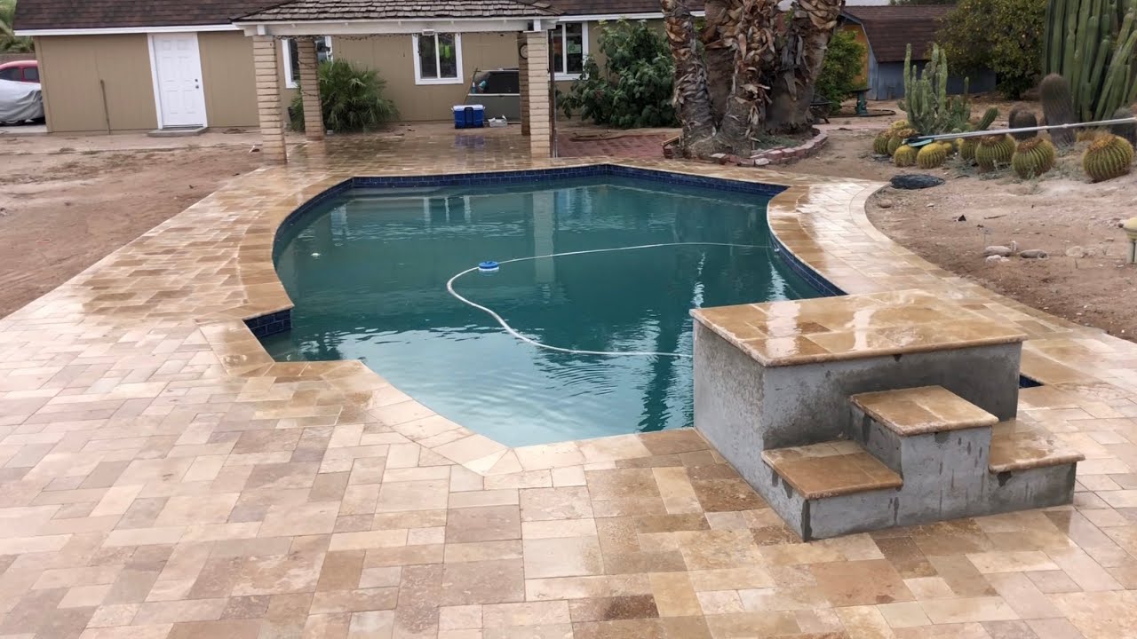 Pool deck remodel to travertine pavers