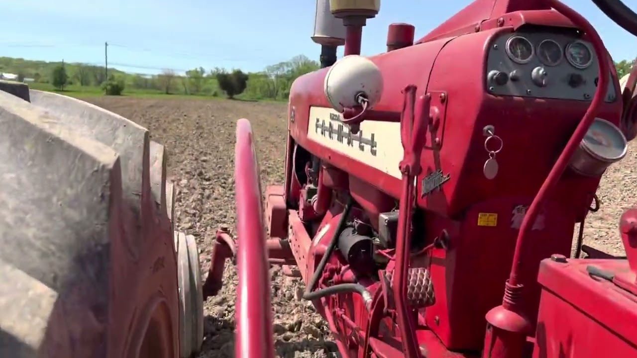 International Farmall 450 Tractor pulling a Cultimulcher