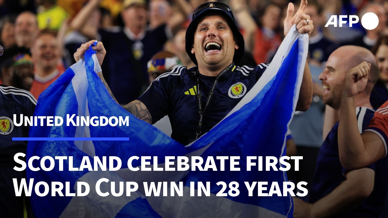 Scottish fans celebrate win in first football World Cup game in 28 years | AFP