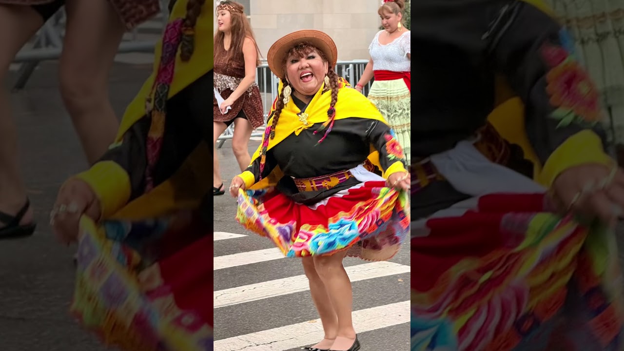 Hispanic Day Parade in NYC tonight October 12. Dancing and singing in the rain