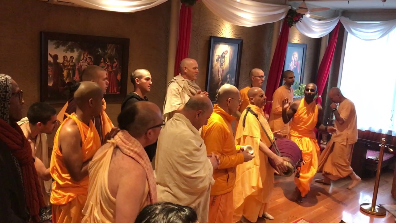 Radhanath Swami chants Sri Guru Carana Padma and Vaisesika Prabhu performs Guru Puja.