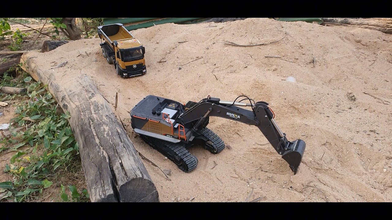 Huina Excavator and Dump Truck on Sand Mound