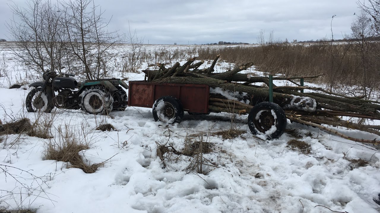 Заготівля дров , MotoTRUCK К-750 M на колісних ланцюгах  , лебідка виручає .