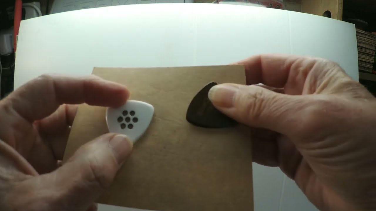 Guitar picks - My pick holding method.