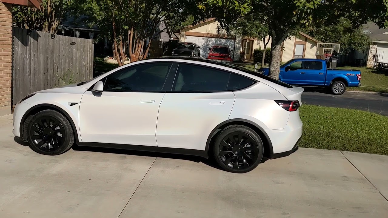 Tesla model Y wrapped in 3M 2080 satin flip ghost pearl vinyl walk around.