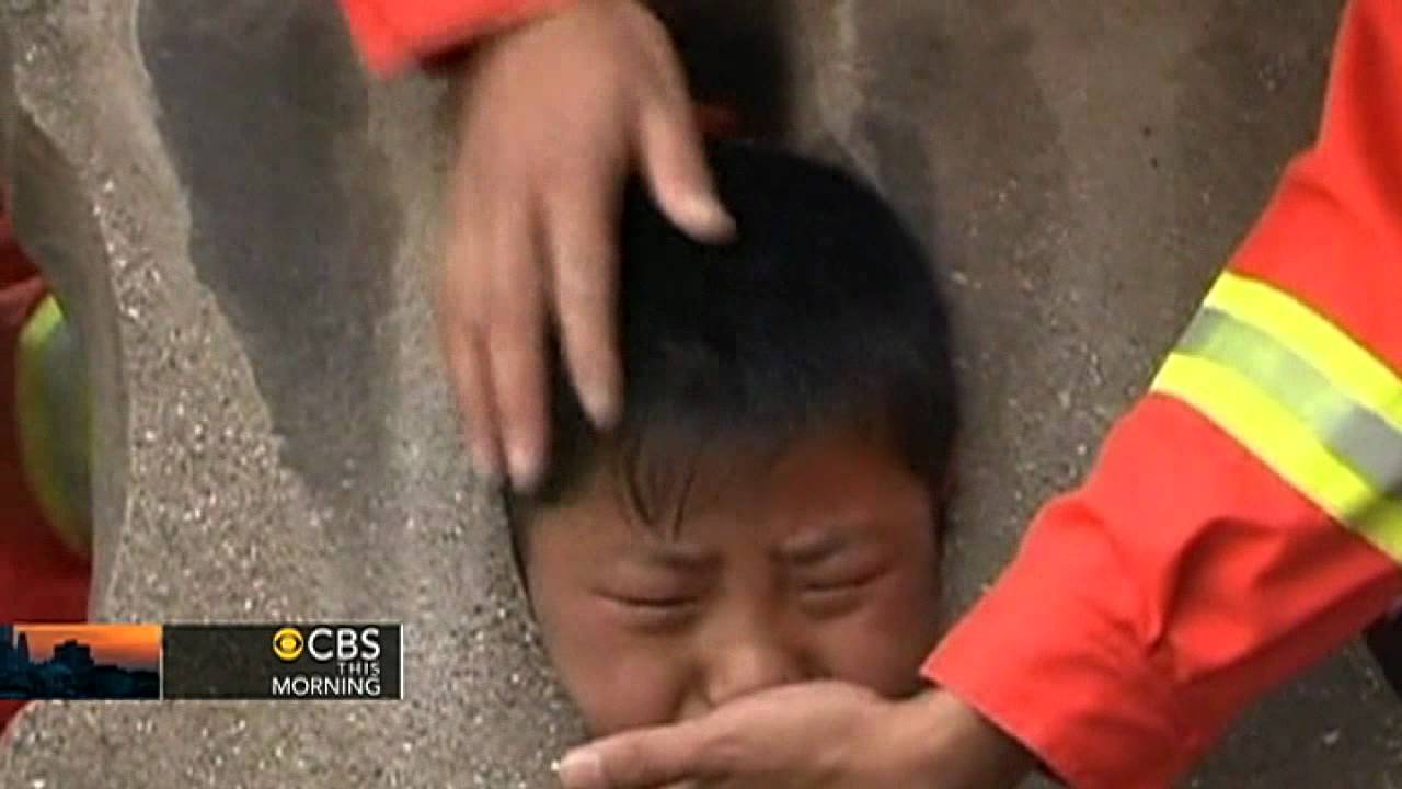 Boy gets head stuck in stone railing