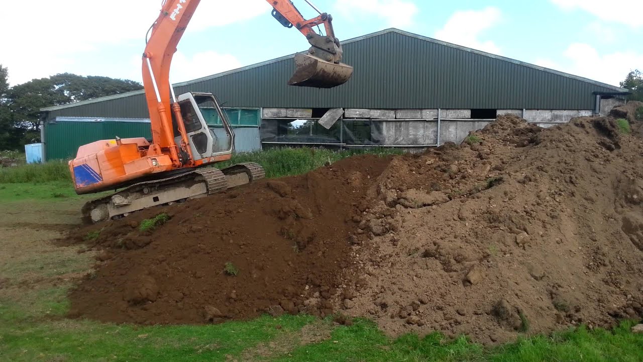Fiat-Hitachi FH130-3 Ramping Topsoil Pile