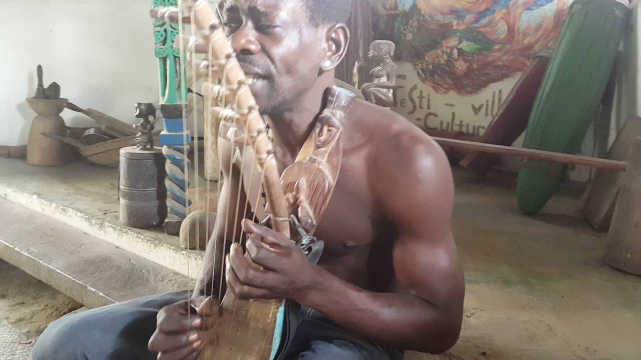 Bokaye playing the Ngombi at Ebando