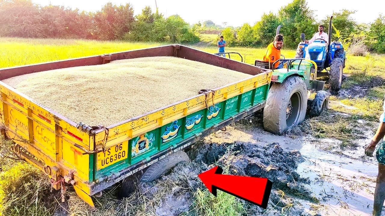 John deere 5045D tractor stuck in mud Rescued by now holland tractor and John deere tractor.