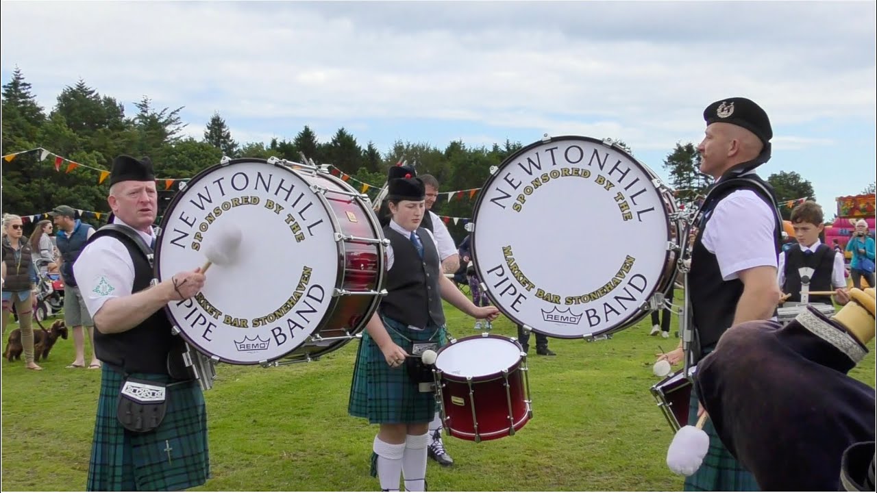 Newtonhill Pipe Band play on the march to start their displays during 2019 Stonehaven Highland Games